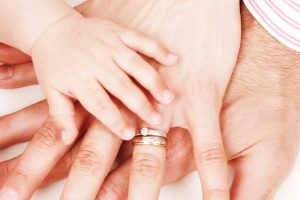 Parents with baby for child support cover
