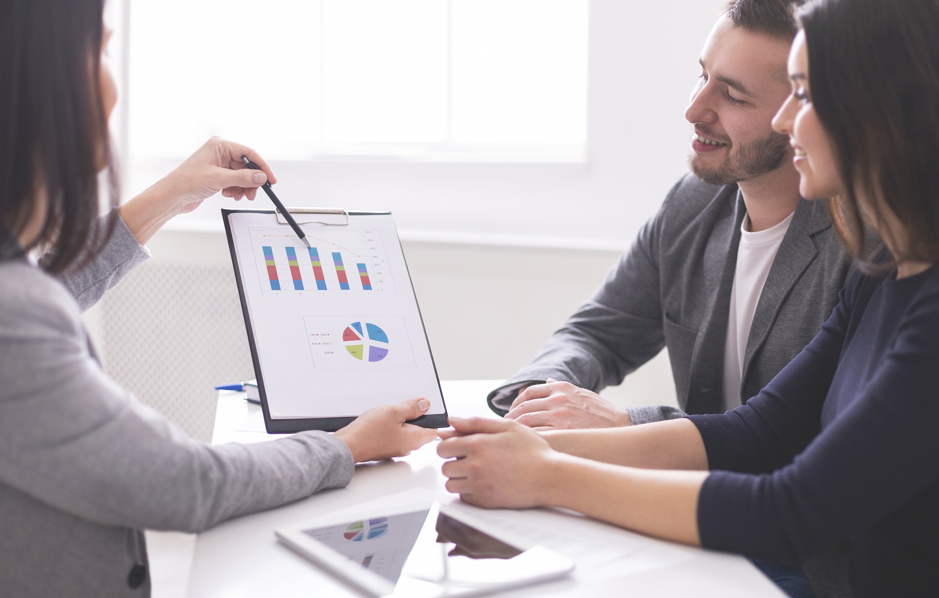 Financial advisor discussing with couple Financial advisor discussing with couple